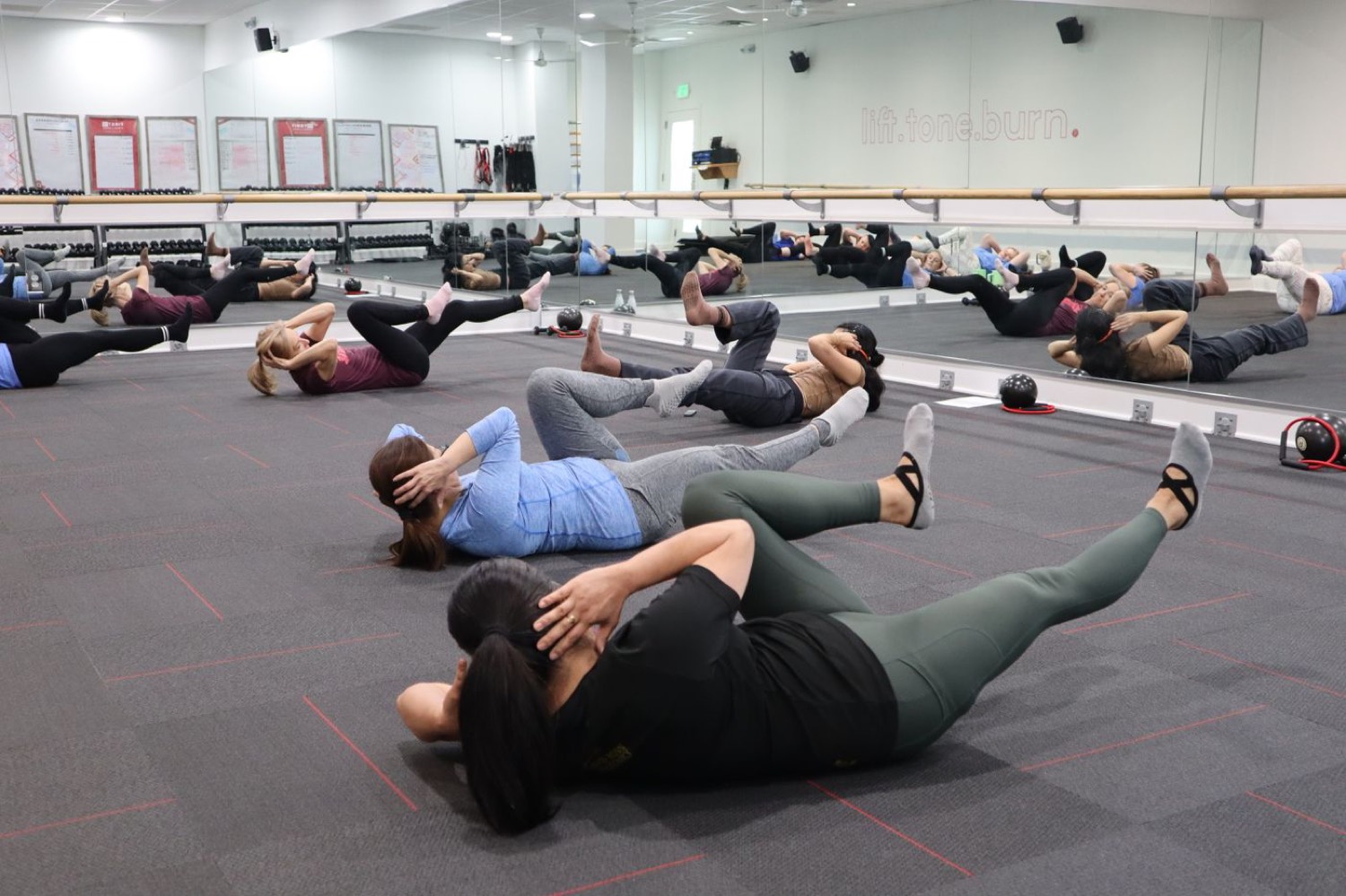 A group fitness class training together in a studio